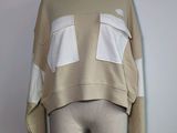 a close up of a mannequin torso with a sweater on it