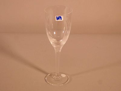 a wine glass that has a blue sticker on it