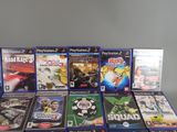 a lot of video games sitting on a table