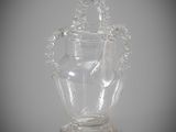 a glass vase with a handle and a handle on it