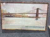 a picture of a picture of the brooklyn bridge on display