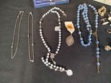 a lot of necklaces that are on a table