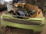 a box full of assorted items in a garage