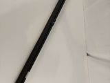 a black pen sitting on top of a white sheet of paper