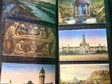 a lot of paintings that are on display on the table