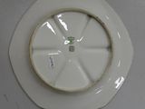 a white plate with a green and white design on it