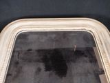 a reflection of a person in a mirror on the floor