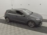 an image of a grey car parked in a garage