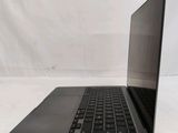 an open laptop computer sitting on top of a white surface