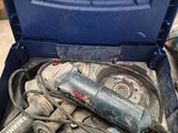 an open tool box with tools in it sitting on the floor