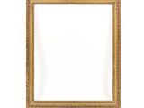 a gold frame on a white wall with a white background