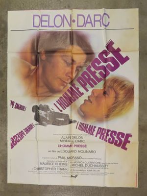 an old movie poster of a man and a woman kissing in front of each other