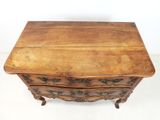 an old wooden chest of drawers sitting on top of a white floor
