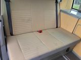 a seat in the back of a van that is empty