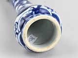 a blue and white vase sitting on a table