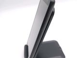 a cell phone that is sitting on top of a stand