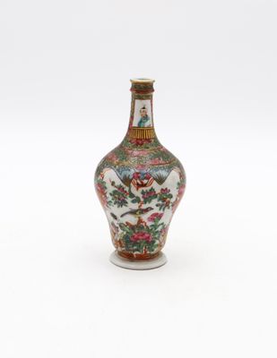 an image of a small vase with a bird and flowers on it