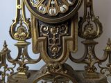 a clock that is sitting on top of a shelf