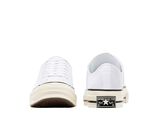 white sneakers with white soles on a white background