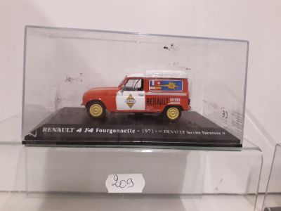 a red and white truck in a glass case