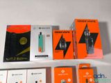 several electronic devices are sitting on a white surface with orange boxes