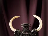 an image of a statue of a bull with horns on a table