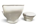 a white toilet and a white bowl on a white background