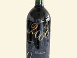 a bottle of wine that is sitting on a table