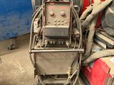 a machine that is sitting next to a pile of other equipment