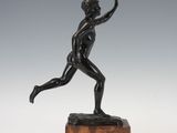 an image of a bronze statue of a boy on a marble base