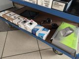 a blue cart that has a bunch of electronics on it