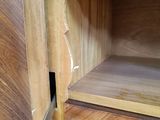 a wooden cabinet with a door and a drawer