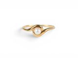 a gold ring with a pearl in the middle