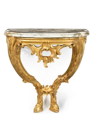 a gold console table with a marble top on a white background