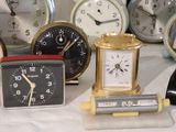many different types of clocks on the table