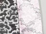 two pieces of fabric with different patterns on them on a white surface