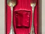 a silverware set in a red box on a table