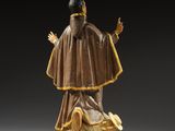 an image of a statue of a man with a goat