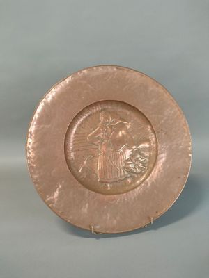 a plate that has a picture of a woman on it