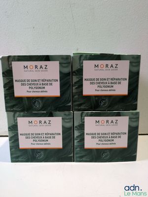 trois boîtes de savon Moraz posées sur une table