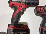 two power tools that are sitting on a table