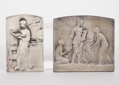 two sculptures of a woman and a man with a baby and a child