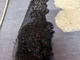 a table with a bunch of different types of lace on it