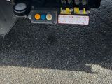 a close up of a truck ' s front bumper and engine compartment