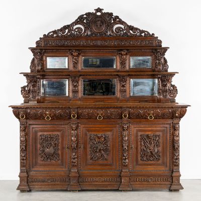 an old wooden cabinet with a mirror on top of it