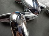 a pair of silver cufflinks sitting on top of a table