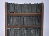 a book shelf with books on top of it