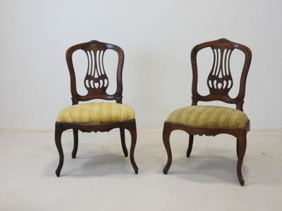pair of antique chairs with upholstered back and upholstered seat