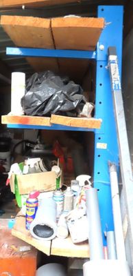 a garage with a lot of items on the shelves
