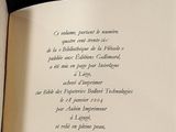 an open book with a poem on it on a table